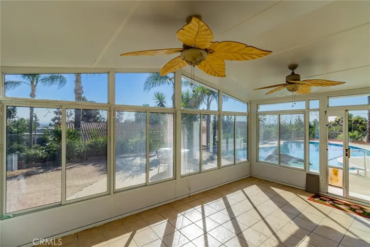 Indoor patio area leading to pool area.