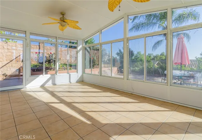 Indoor patio area leading to pool area.