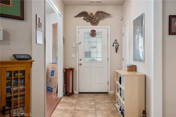Large tiled entry with dining area/den adjacent