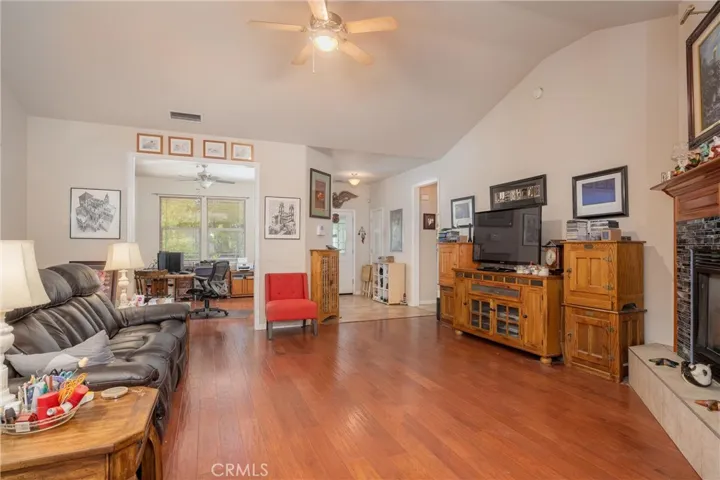 Open, tall ceilings with view of entry and office/dining room