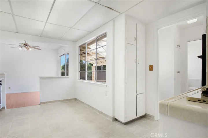 Want a kitchen nook in addition to the dining space? How about under the large window?
