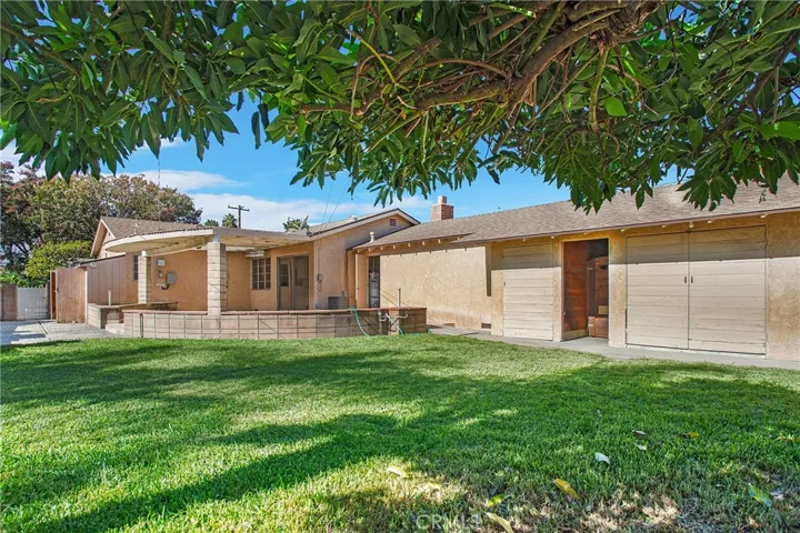 The yard is full of endless possibilities with the covered patio, the herb garden area, access to both of the 2 car garages, TONS of storage cabinets built along the whole backside of the garage, mature trees for shade and access to the RV/Boat area.
