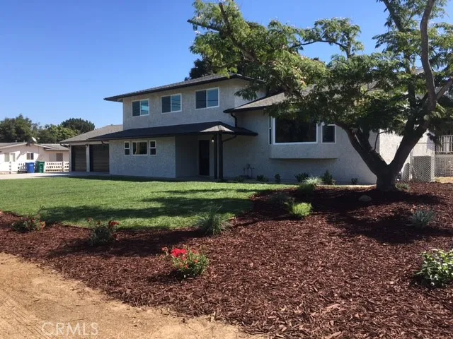View from street - new landscaping and cement driveway