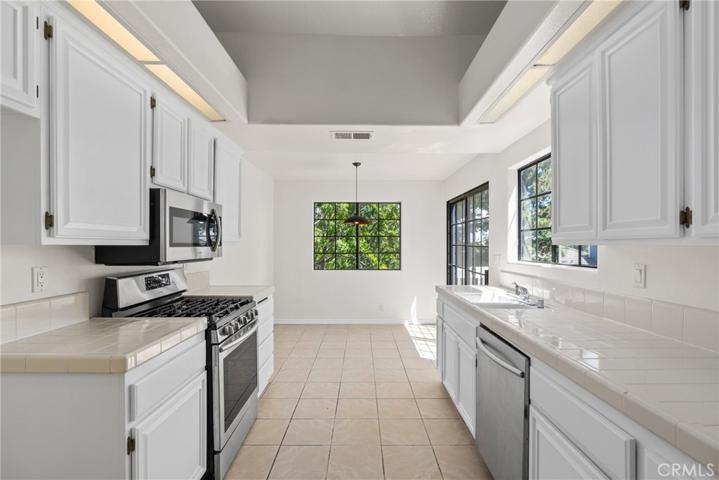 Dine casually in the kitchen with porcelain tile floors!