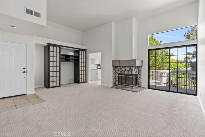 Gather in the inviting living room with high ceilings!