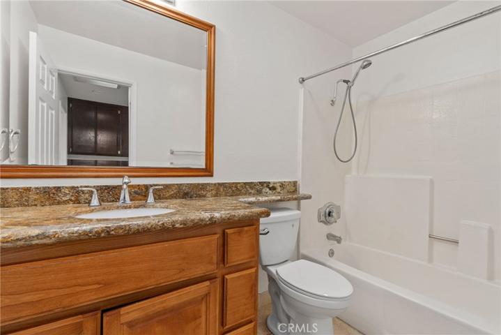 Remodeled hallway bathroom with cherrywood cabinetry!