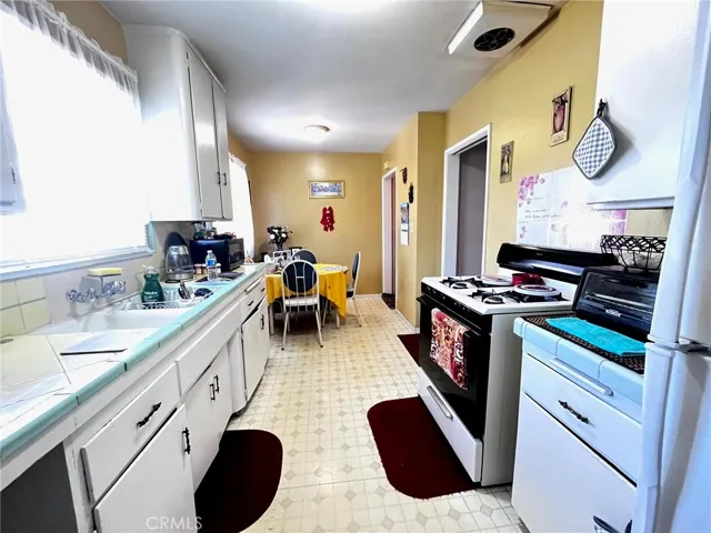 Galley Kitchen with adjacent Laundry Room