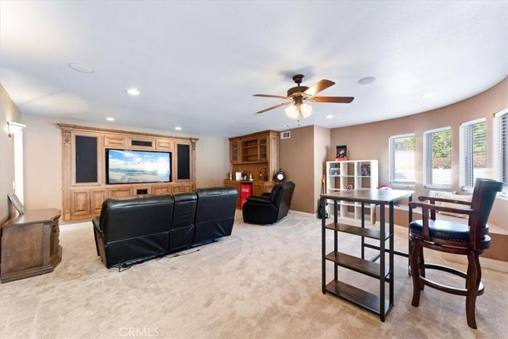 Main floor bedroom/media room with bar