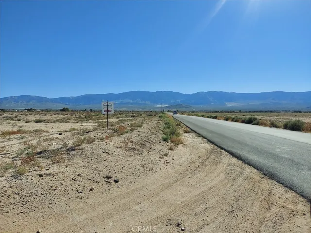 view to the south with paved road access on west side of lot