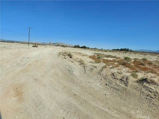 view to the north east with electric lines running on north side of lot