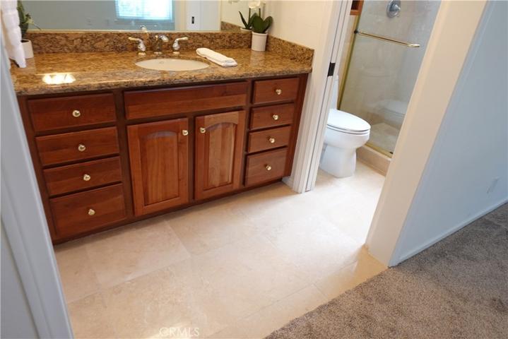Master Bathroom with Granite and Travertine