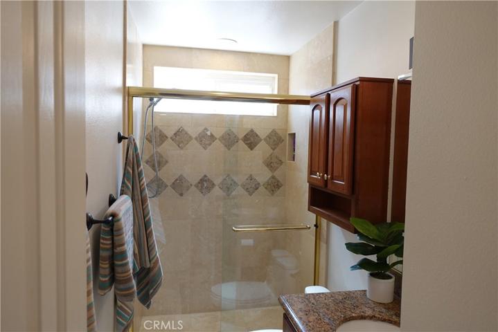 Travertine Shower to Ceiling Lower Bath