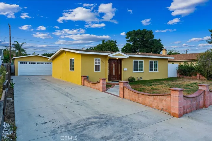 Generous driveway can accommodate many cars, rv or boat/toys