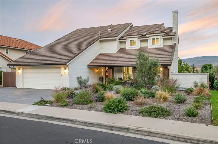 beautifully landscaped with drought tolerant plantings and bluestone pathways