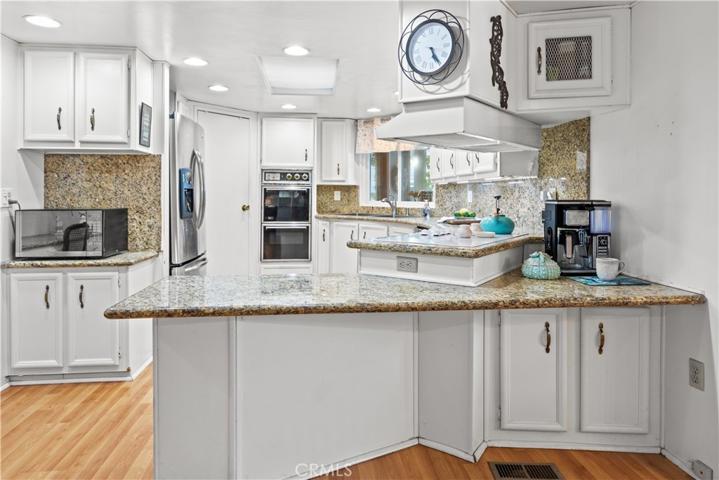Kitchen peninsula with coffee bar area