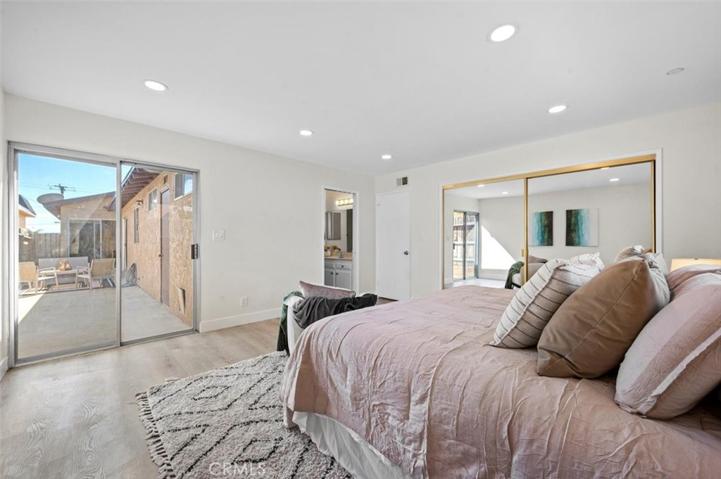 The master bedroom has direct access to the backyard as well