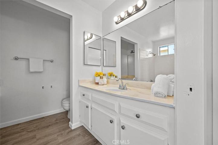 The master bedroom has a bathtub across from the sink