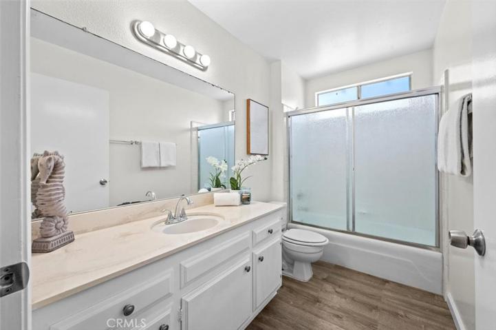 A spacious bathroom located in the middle of the house