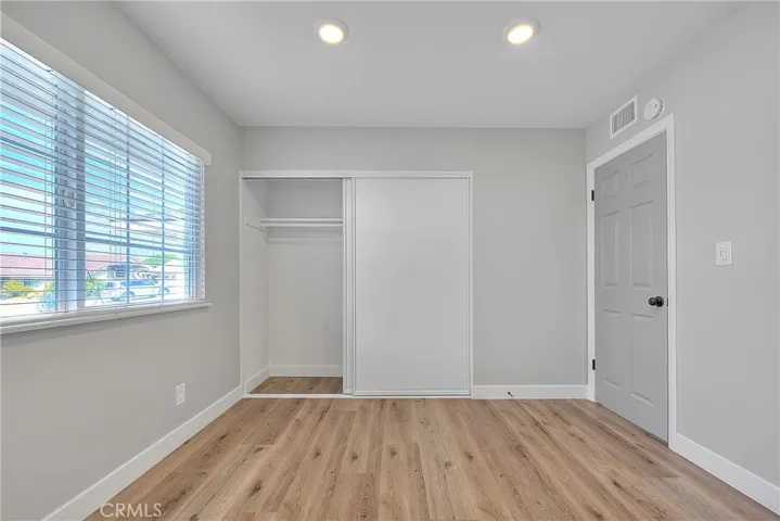Bedroom 2 w/Recessed Lights, New Laminate Waterproof Flooring, and Blinds.