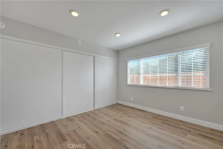 Primary Bedroom 1 w/Recessed lights, Laminate Waterproof flooring, Blinds.