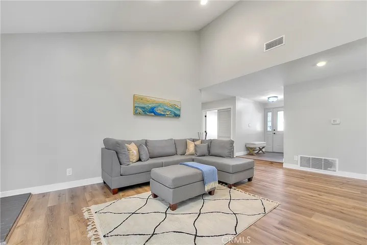 Living Room w/New Laminate waterproof flooring throughout the home.