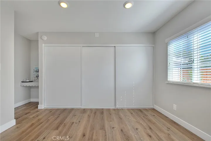 Primary Bedroom 1 w/Recessed lights, Laminate Waterproof flooring, Blinds.
Spacious Closet and Vanity Area.