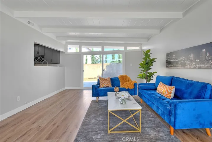 Family Room w/New Laminate waterproof flooring and New Energy Efficient Sliding Glass Doors.