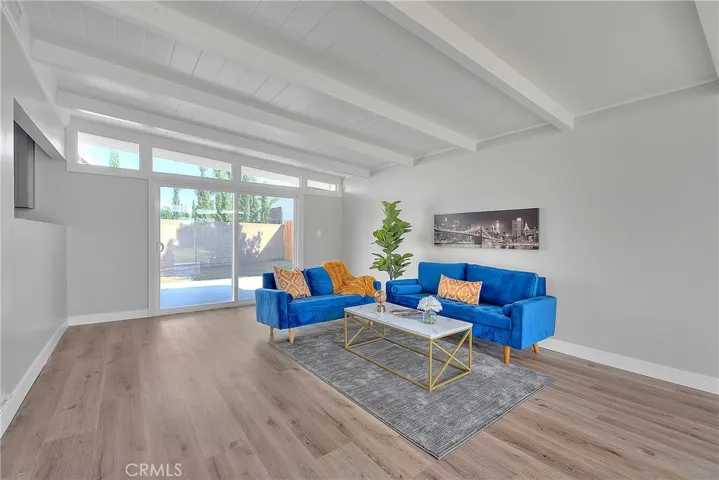 Family Room w/New Laminate waterproof flooring and New Energy Efficient Sliding Glass Doors.