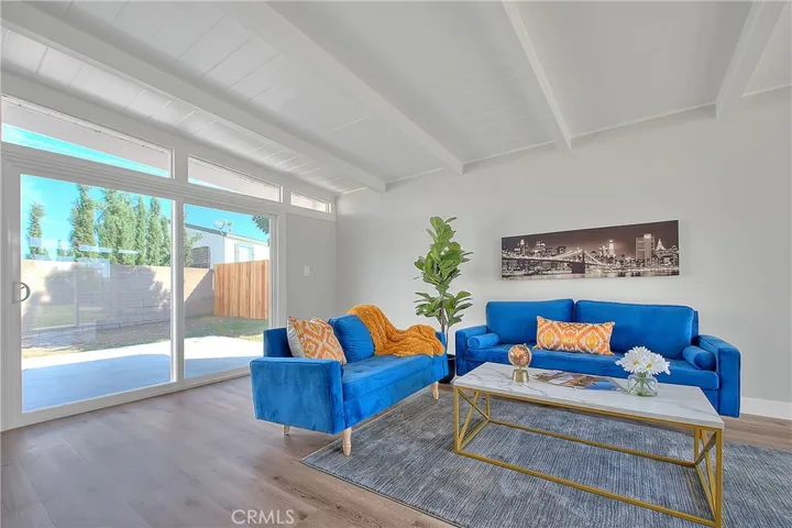 Family Room w/New Laminate waterproof flooring and New Energy Efficient Sliding Glass Doors.