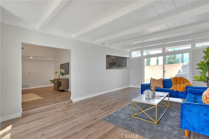 Family Room w/New Laminate waterproof flooring and New Energy Efficient Sliding Glass Doors.