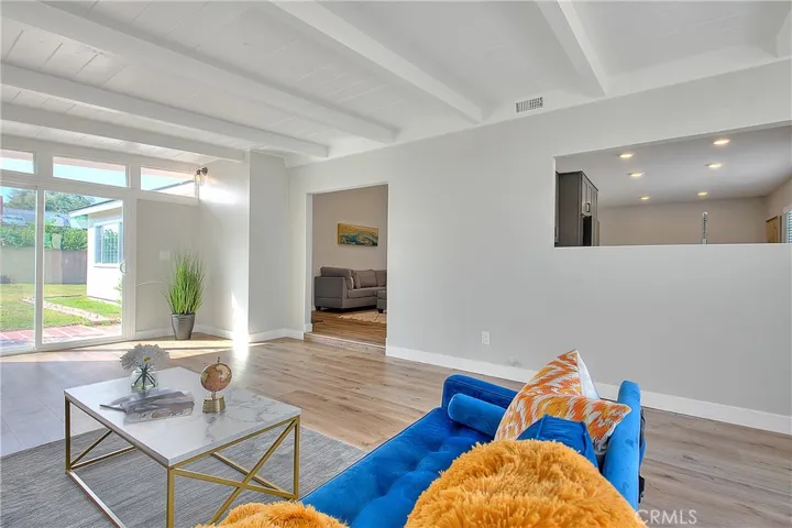 Family Room w/New Laminate waterproof flooring and New Energy Efficient Sliding Glass Doors to the left and right side of the room.