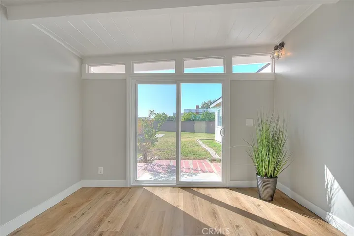 Family Room w/New Laminate waterproof flooring and New Energy Efficient Sliding Glass Doors.