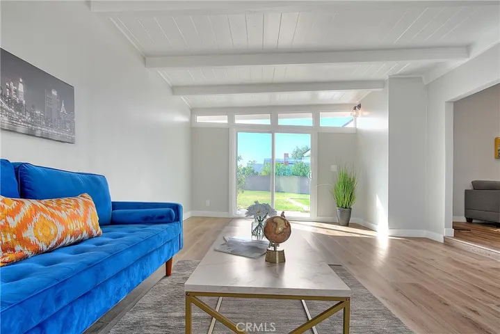 Family Room w/New Laminate waterproof flooring and New Energy Efficient Sliding Glass Doors.
