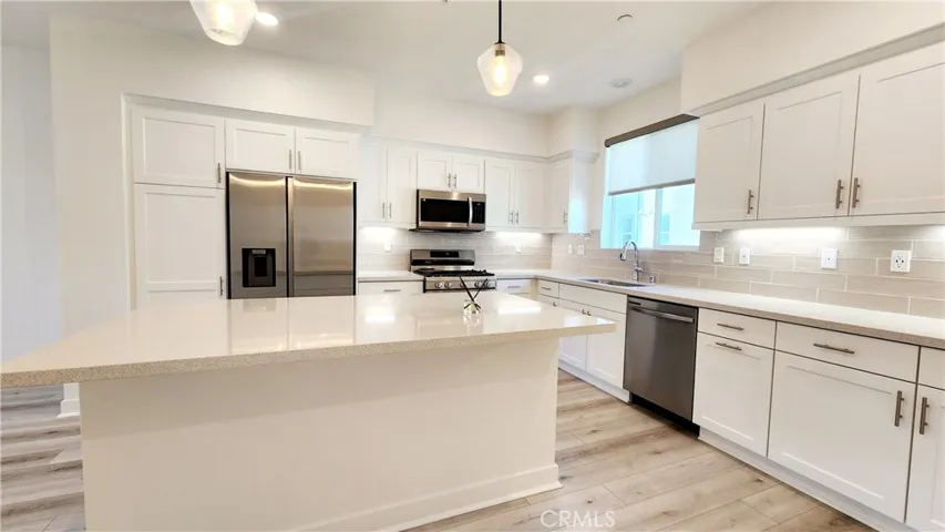 Quartz Counters, Soft Close Cabinetry, Pendant Lights