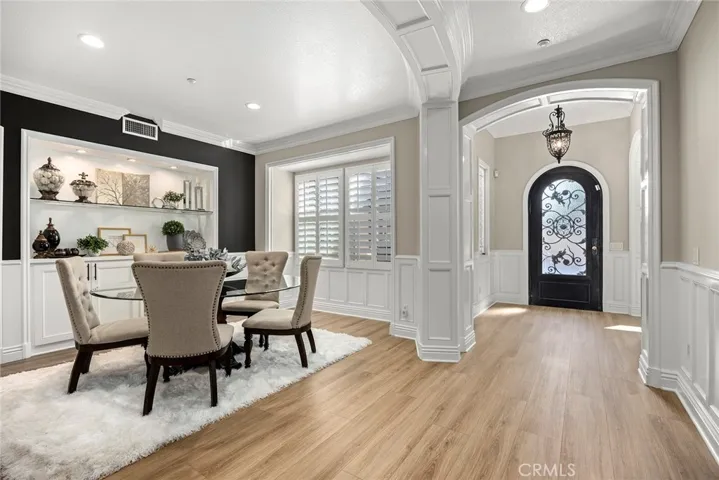 Lots of architecture molding thru-out Dining room has a gorgeous built in hutch surrounded by wainscoting and arched doorway molding