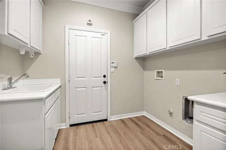 Laundry room and space for another refrigerator