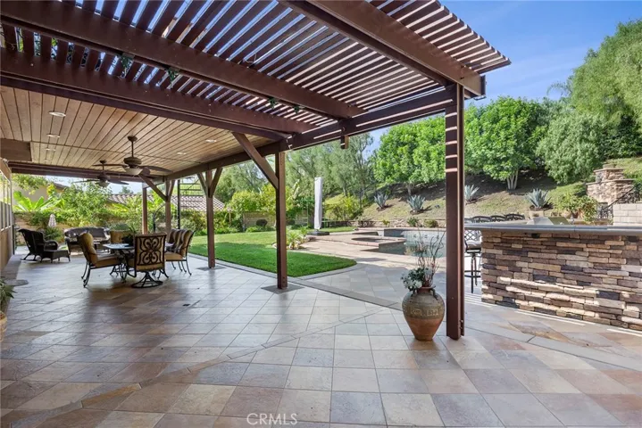 Great covered patio with tongue and grove ceiling outdoor recessed lighting with fans. Fabulous for parties. Deck has hangers to put toddlers swings on