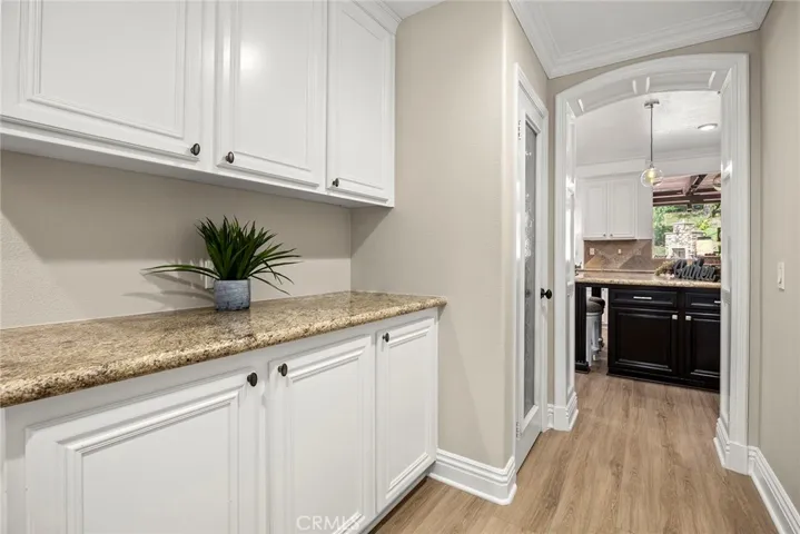 Butlers pantry with additional walk-in storage area