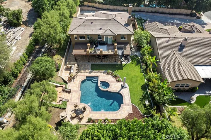 Drone shot showing backyard of the home and property.