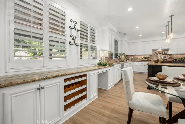 Picture of wine rack and storage with plantation shutters that are thru-out the home.