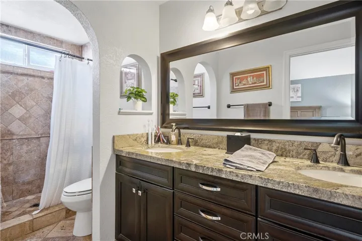 Master bathroom with custom travertine