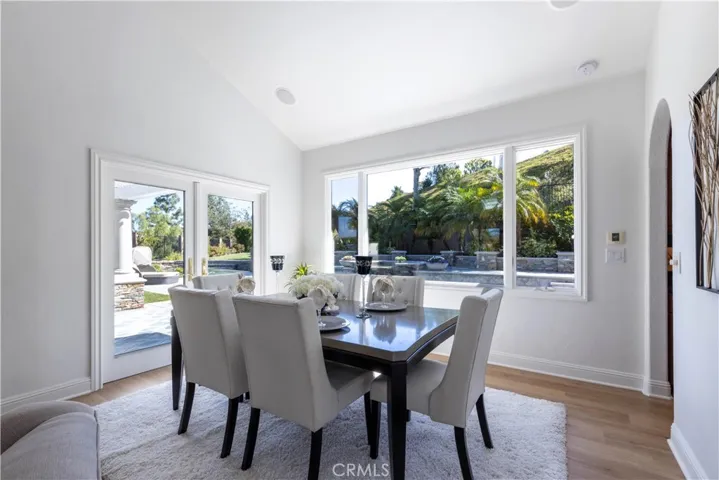 French doors and widw window bringin sunshine in.