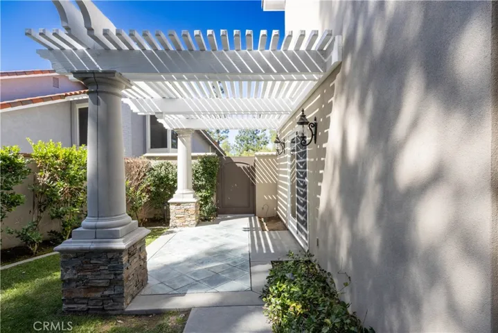 Side yard with covered patio.
