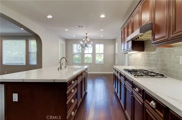 Kitchen area and view of formal dining area
