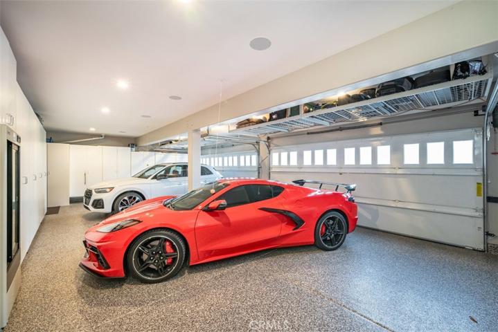 Attached 4 car garage w/custom cabinetry and Epoxy floors