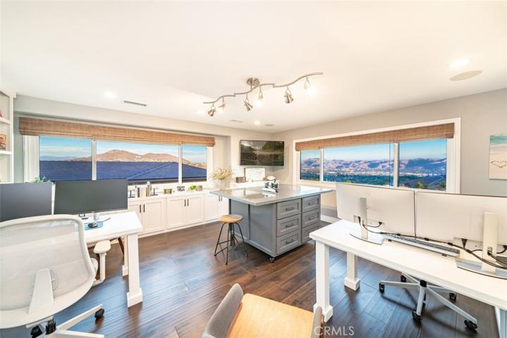 Office/craft room with custom island and work stations