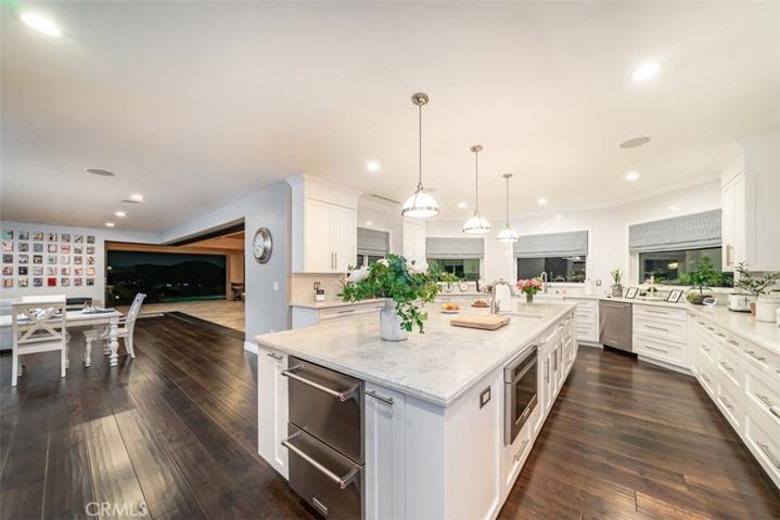 Kitchen at night with pocket doors open