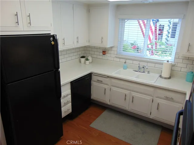 Gourmet kitchen with new window and custom back splash