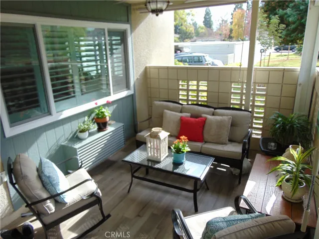 Covered front patio with sun shape and ceiling fan