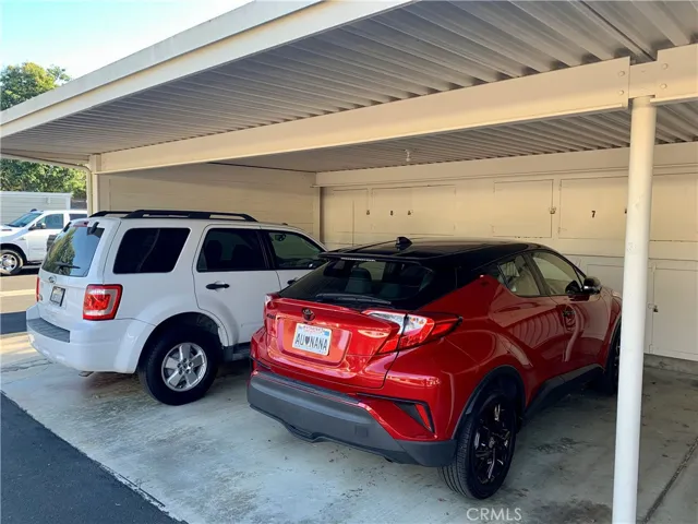 Covered carport with extra storage.